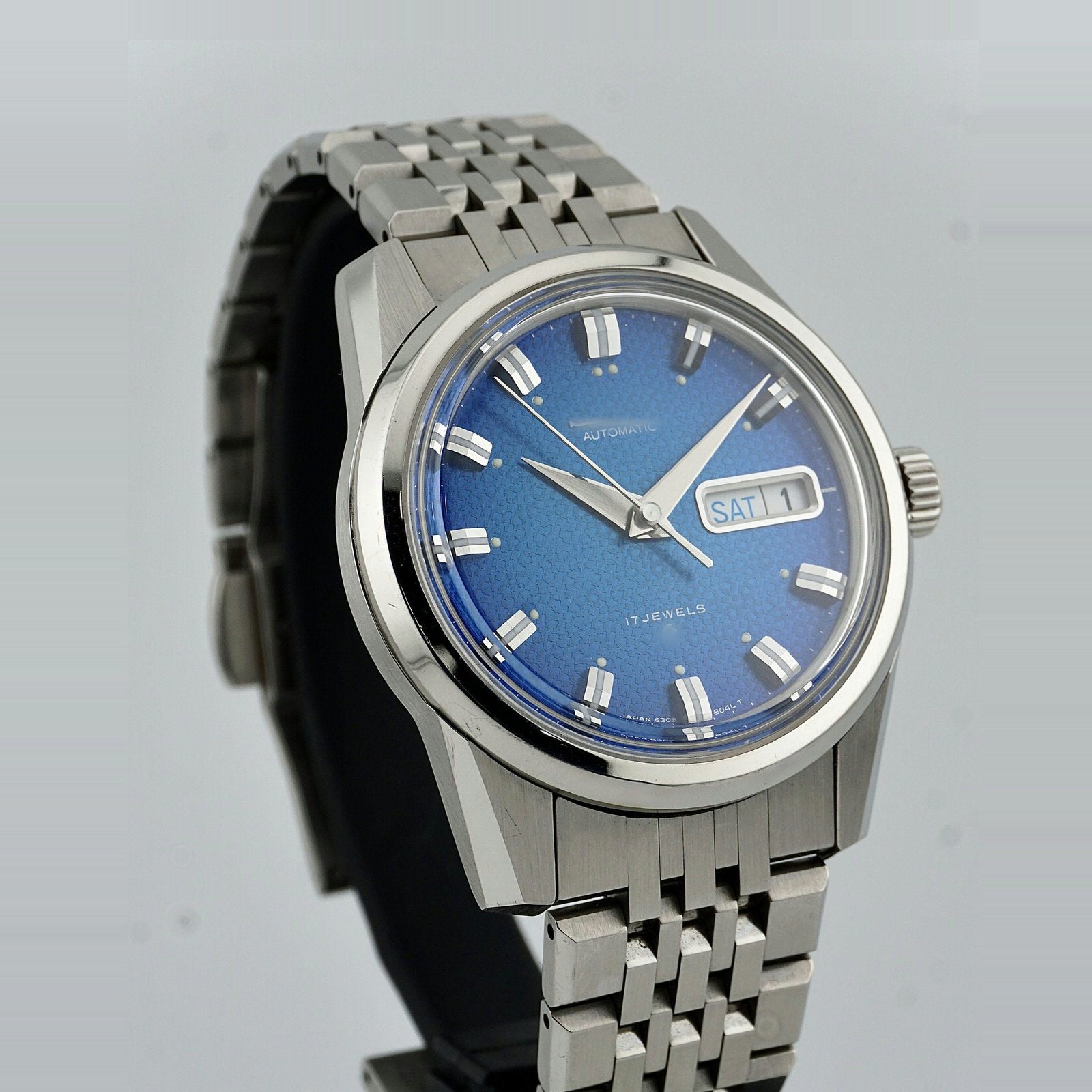 The same watch after restoration, angled view