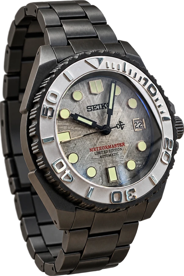 Gunmetal diver with a silver meteorite dial and complete bracelet — AI-assisted wider view